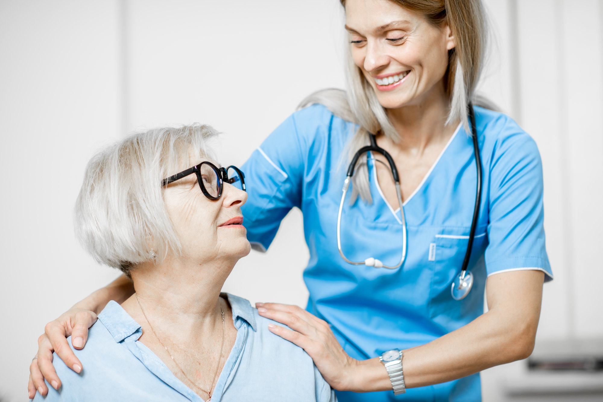 Nurse taking care of senior woman